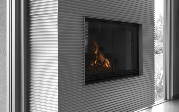 the use of corrugated metal panels as fireplace wall surround