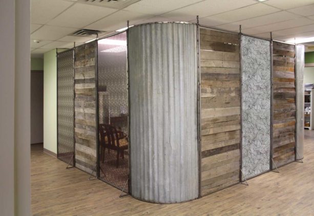 the use of corrugated metal wall in a modern rustic clinic interior