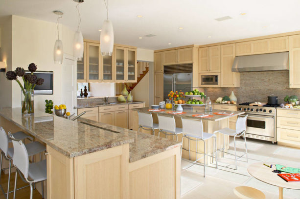 a beach style kitchen with maple cabinets and Linen White wall paint