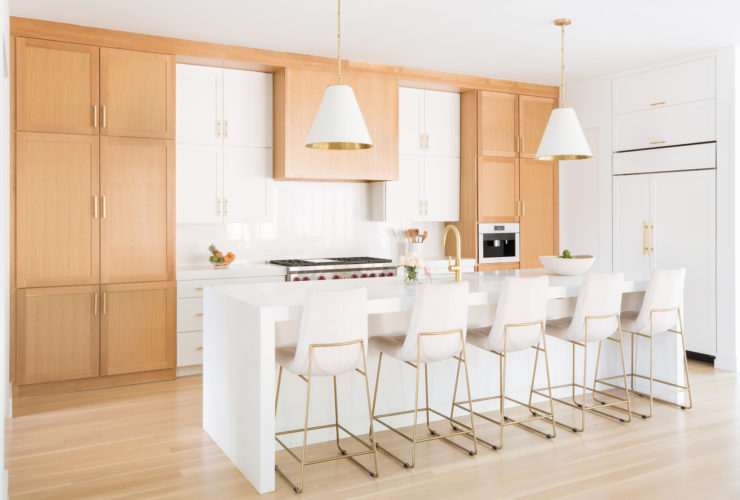 a contemporary kitchen with light oak cabinets and benjamin moore white heron wall paint