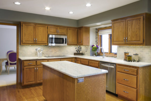 an eclectic kitchen with honey oak cabinets and benjamin moore coventry gray wall paint