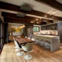a mid-century modern kitchen dining with clear-coated quartered oak floor