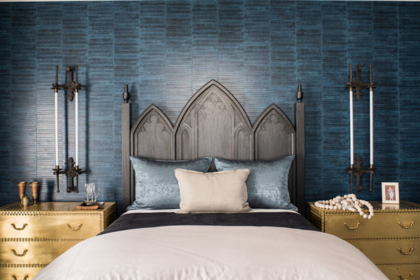 an eclectic bedroom with black, gold, and dark blue color scheme