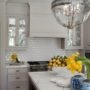 white subway tile and white grout showing a traditional feel in a Victorian kitchen