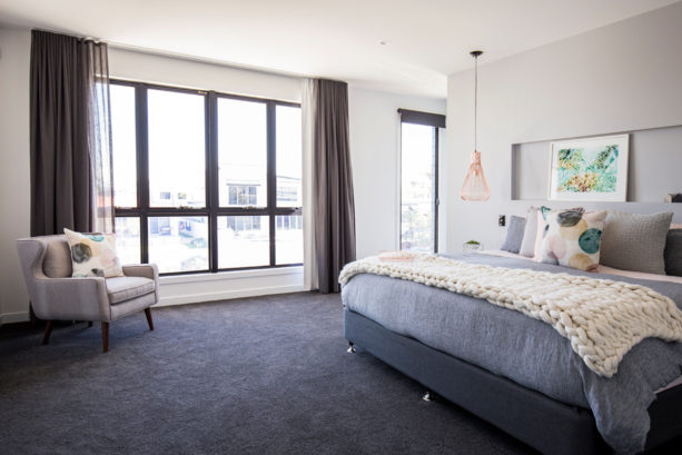 dark grey carpet in a contemporary bedroom with light grey walls