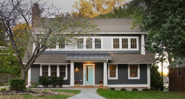 dark grey craftsman exterior with pastel blue front door
