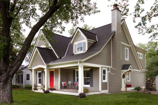 greige house, white trim, and red front door exterior design