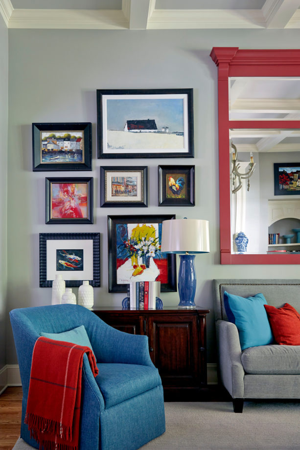 grey, blue, and red color scheme in a traditional living room