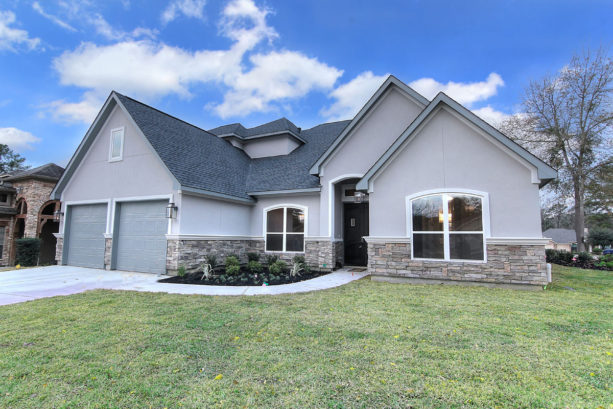 white trim and natural stone material in a lighter gray transitional exterior