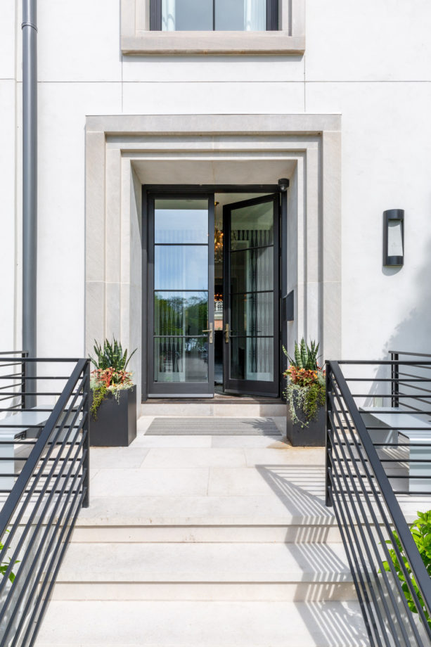 a contemporary front door with riffled-style trim