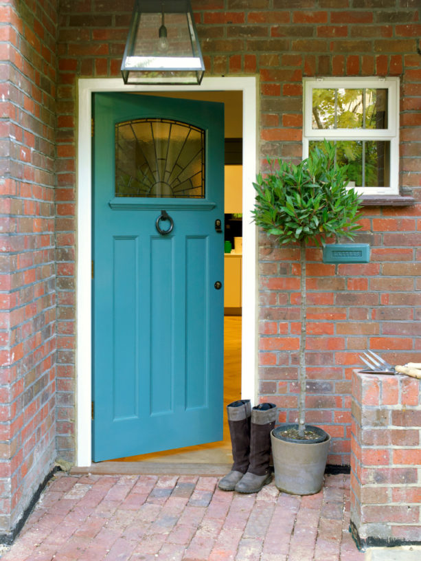 gorgeous cerulean blue front door for red brick house