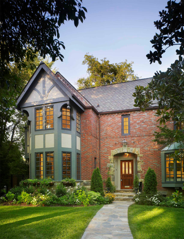 sage green paint color to create a complementary look in red brick exterior