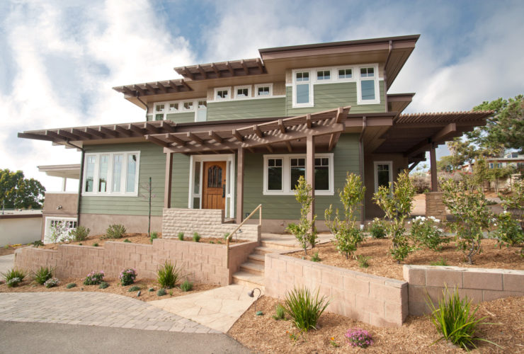 an idea for transitional ranch style design with flat roof and vinyl siding
