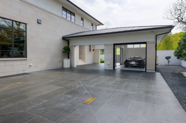 elegant carport idea with tile flooring in front of a contemporary garage