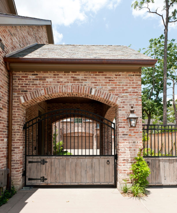 inspiration for a timeless stone carport in front of a detached garage