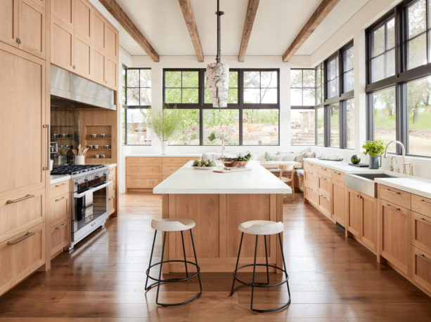 white oak shaker floor to ceiling cabinets with light wood finish