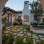 spanish colonial style home featuring a private courtyard