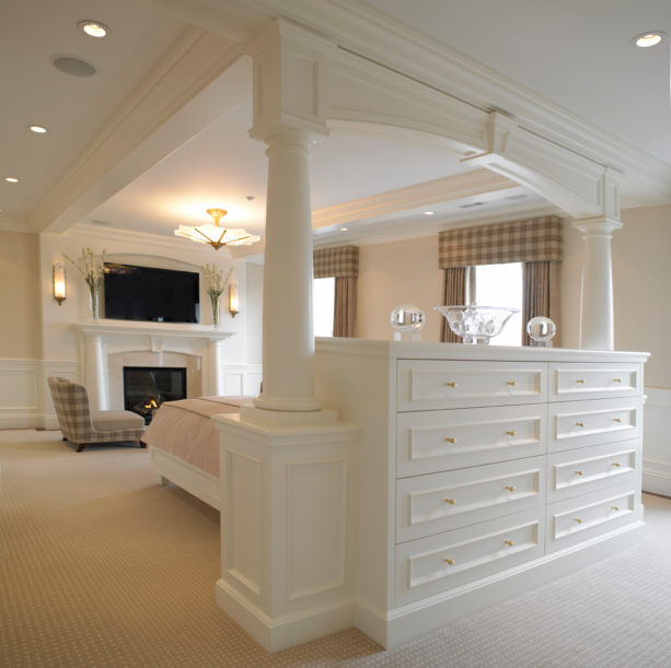 crisp storage bed in the middle of a white traditional room