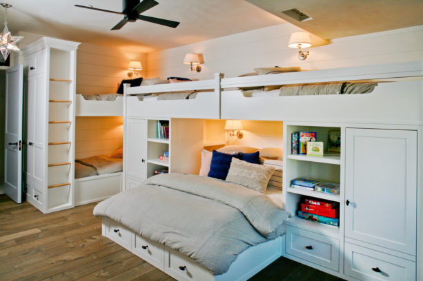 kid’s room in beach style with a wall bed in the middle