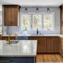 transitional l-shaped kitchen with an undermount sink and casement windows over