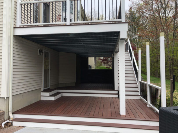two-story deck idea with a ceiling over the first story underneath