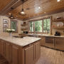 beige kitchen color mixed with light brown raised-panel cabinets to achieve a homey feeling