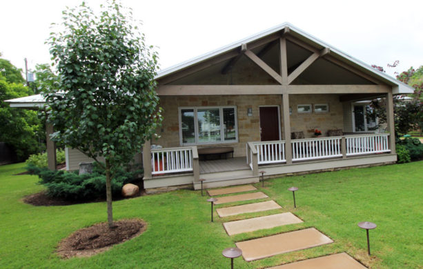 50’s ranch style home with a spacious contemporary front porch