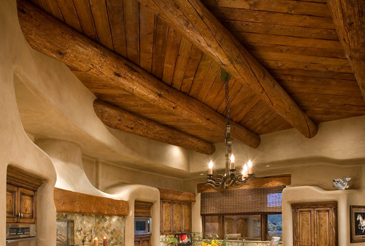 curvy two-level kitchen island made of dark-toned wood