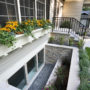 extra wide stone basement window well