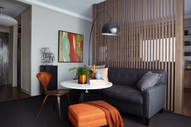 modern living room with vertical wood slat wall as a partition