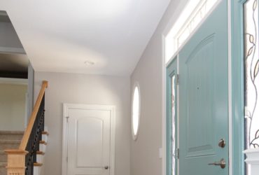 small foyer entryway with hickory flooring idea