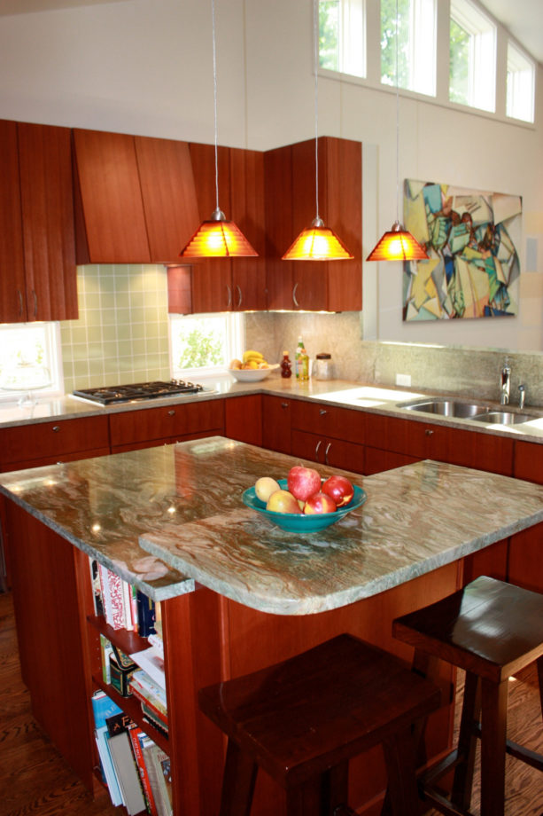 square-shaped two-level kitchen island with a half-sized upper section
