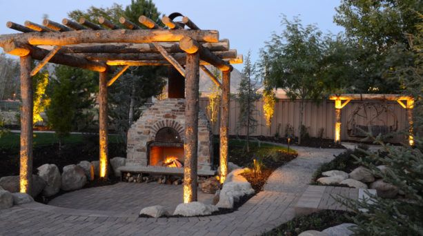 traditional patio with trellis, an outdoor fireplace, and a custom pizza oven