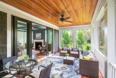 combination of wood ceiling, railing, and screen to enclose a porch for living space
