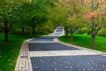 mix of belgian porphyry squares, reclaimed curbing, and european sandstone to widen a driveway