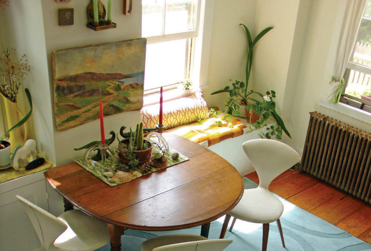 curvy drop leaf dining table against the wall