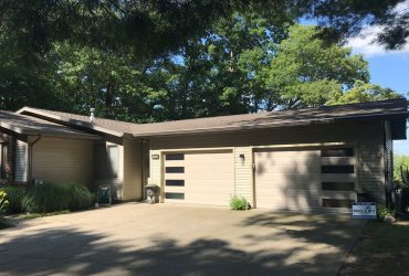 steel garage doors with long panels in mid-century design