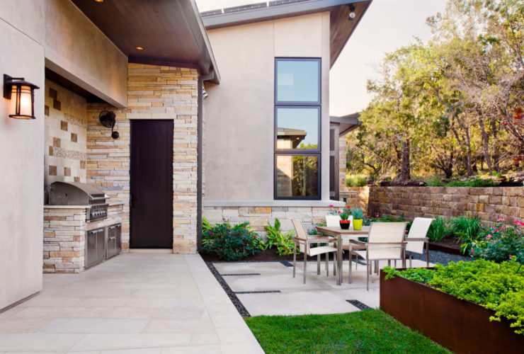 timeless concrete patio in a small backyard as a bbq area