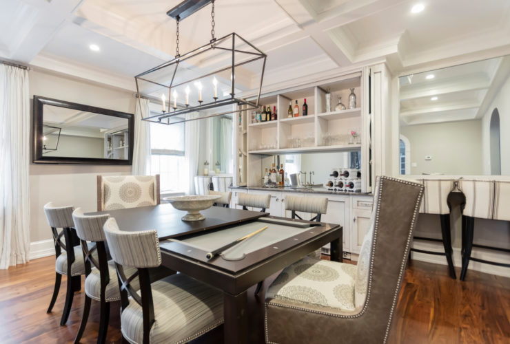 trendy dining room with billiard and a dry bar