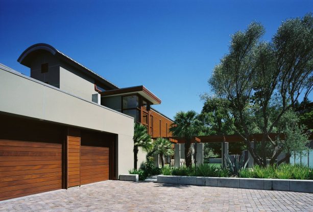 trendy mid-century garage doors made of horizontal slats wood