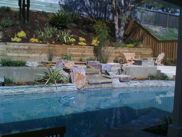 pressure treated wood retaining wall on a sloped area