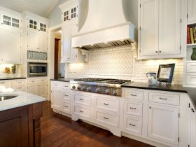 snowcap white cabinets with black glass hardware