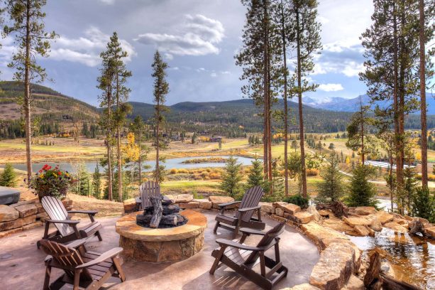 42” round rustic fire pit in a patio completed with a water feature