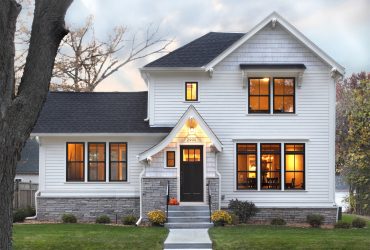 a black and white color scheme is applied to the roof and the siding of the house