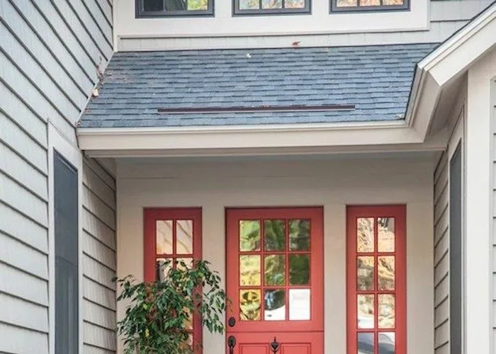 benjamin moore - tomato tango coral front door with window and sidelights combined with off-white walls