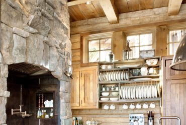 combination of reclaimed oak and natural stone element in a log cabin kitchen