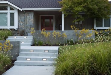 concrete front stairs with a landing to change direction
