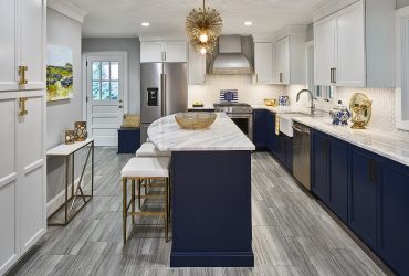 gray ciudad kitchen floor tile with dark blue cabinets