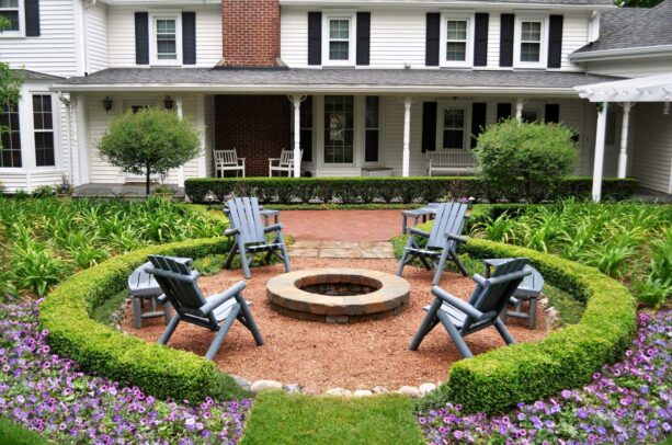 round gravel patio with a fire pit as an extension of a brick patio