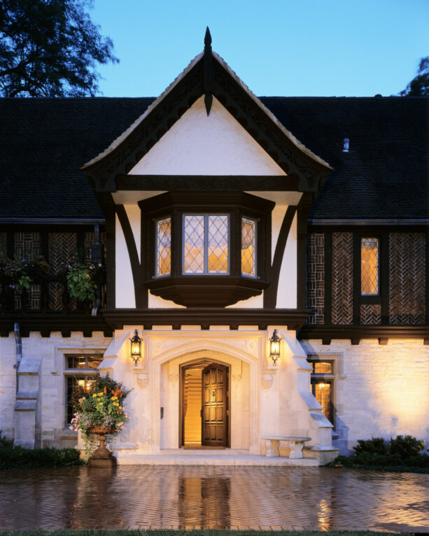 the rustic exterior of a bay window with dark brown trim